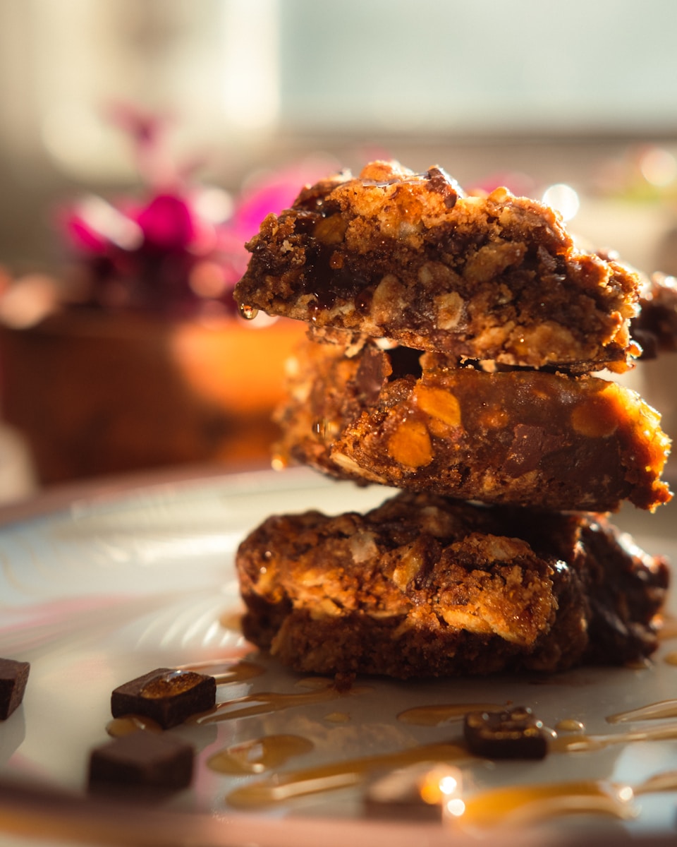 a stack of cookies sitting on top of a white plate